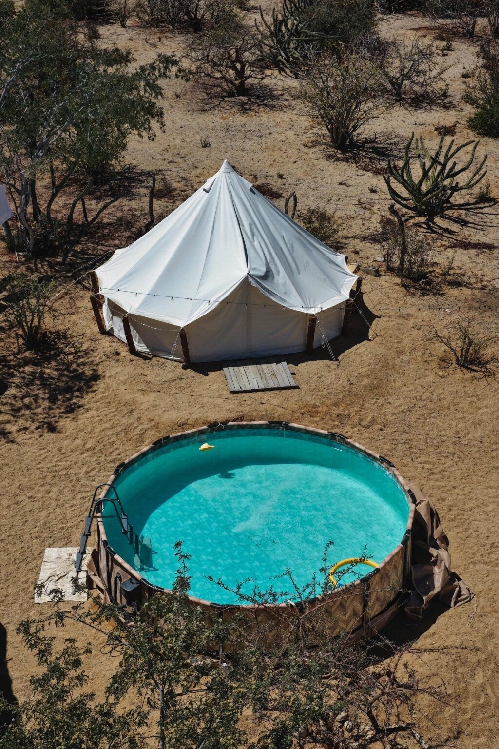 Aerial view of the glamping swimming pool and bell tent